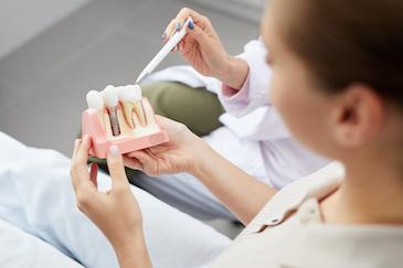 close up of dentist with dental tool | dentist scarborough on
